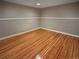 Spacious finished basement with wood-look floors, fresh paint, and ample natural light at 9236 W Euclid Ave, Littleton, CO 80123