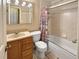 Full bathroom with vanity, toilet, and shower/tub combination at 9236 W Euclid Ave, Littleton, CO 80123