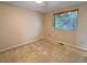 Cozy bedroom featuring neutral carpeting and a window providing natural light at 9236 W Euclid Ave, Littleton, CO 80123