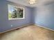 Bedroom features a ceiling fan, window, carpet floor, and neutral paint at 9236 W Euclid Ave, Littleton, CO 80123