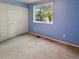 Comfortable bedroom with carpet floors, window, and closet at 9236 W Euclid Ave, Littleton, CO 80123