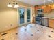 Cozy dining area with sliding door access to the outdoor deck at 9236 W Euclid Ave, Littleton, CO 80123