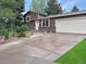Charming single-Gathering home with a well-maintained lawn, attached two-car garage, and inviting curb appeal at 9236 W Euclid Ave, Littleton, CO 80123