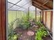 A look inside a thriving greenhouse filled with various plants and crops at 9236 W Euclid Ave, Littleton, CO 80123