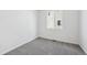 A cozy bedroom featuring soft gray carpet and bright natural light from a window at 6974 E 126Th Dr, Thornton, CO 80602