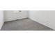 A cozy bedroom featuring soft gray carpet and bright natural light from a window at 6974 E 126Th Dr, Thornton, CO 80602