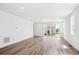 Expansive living area featuring hardwood flooring, recessed lighting, and backyard access at 6974 E 126Th Dr, Thornton, CO 80602