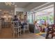 Interior shot of dining area featuring comfortable seating with lots of natural light, with a bar in background at 1642 N Lafayette St # 5, Denver, CO 80218