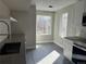 Bright kitchen with stainless appliances, tile backsplash and windows at 1642 N Lafayette St # 5, Denver, CO 80218