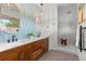 Modern bathroom with dual vanities, quartz countertops, and a luxurious walk-in shower at 350 Holly St, Denver, CO 80220