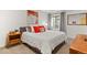 Well-lit bedroom with natural light, cozy decor, and calming color palette at 350 Holly St, Denver, CO 80220