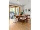 Cozy dining room with natural light, wooden table, stylish chairs, and access to the outdoor patio at 350 Holly St, Denver, CO 80220