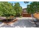 Beautiful home with mature trees, professional landscaping, and a private driveway at 350 Holly St, Denver, CO 80220