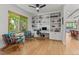 Home office boasts built-in shelving, natural light, modern furnishings, and a dedicated workspace at 350 Holly St, Denver, CO 80220