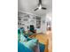 Bright home office features custom built-ins and comfortable seating and bright sunlight at 350 Holly St, Denver, CO 80220