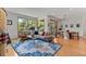 Spacious living area with large windows, modern decor, and an adjacent dining space at 350 Holly St, Denver, CO 80220