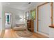 Sunlit room with hardwood floors, a comfy daybed, and a playful artistic touch at 350 Holly St, Denver, CO 80220