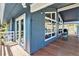 Corner view of home showcasing a spacious outdoor deck with furniture and stylish exterior at 779 Aspen Way, Evergreen, CO 80439