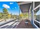 Outdoor deck featuring open views of surrounding trees and a mountain landscape at 779 Aspen Way, Evergreen, CO 80439