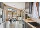 Bright kitchen with stainless steel appliances, gray cabinets, butcher block countertops, and a view of the outdoors at 779 Aspen Way, Evergreen, CO 80439