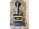 Living room fireplace with stone surround at 779 Aspen Way, Evergreen, CO 80439