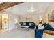 Comfortable living room features plush blue sofas, wood accents and modern decor at 779 Aspen Way, Evergreen, CO 80439