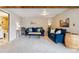 A comfortable living room features bright walls, plush blue sofas, and wood accents at 779 Aspen Way, Evergreen, CO 80439