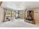 Spacious living room with carpet, a fireplace, and a large window with great views at 779 Aspen Way, Evergreen, CO 80439