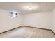Carpeted basement space with a small window offering natural light at 3270 S Krameria St, Denver, CO 80222