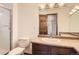 Bright full bathroom offers granite counters, glass shower, and vanity storage at 3270 S Krameria St, Denver, CO 80222