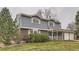 Traditional two-story home with a brick and siding exterior and a covered front porch at 3270 S Krameria St, Denver, CO 80222