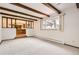 Spacious living room featuring natural light and an open view to the kitchen at 3270 S Krameria St, Denver, CO 80222