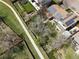 Aerial view of a home with solar panels, well-maintained lawn, and charming backyard at 12622 W Radcliff Ave, Morrison, CO 80465