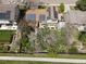 Aerial view of a home with solar panels, a spacious backyard and a well-maintained lawn at 12622 W Radcliff Ave, Morrison, CO 80465
