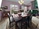 Bright dining area with a large window and a view to another room, creating an inviting atmosphere at 12622 W Radcliff Ave, Morrison, CO 80465