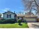 Charming single-Gathering home with a well-manicured lawn and attached two car garage at 12622 W Radcliff Ave, Morrison, CO 80465
