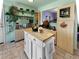 Unique kitchen featuring an island and open shelves, creating a functional and stylish space at 12622 W Radcliff Ave, Morrison, CO 80465