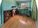 Cozy room featuring a bookcase, natural light from the window, and light-colored wood floors at 12622 W Radcliff Ave, Morrison, CO 80465