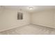 Finished basement featuring neutral carpet and a window at 7778 S Cherry Ct, Centennial, CO 80122
