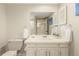 Bathroom featuring a vanity with a mirror and white cabinets at 7778 S Cherry Ct, Centennial, CO 80122