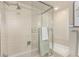 Bathroom featuring a shower with a glass enclosure and tiled walls at 7778 S Cherry Ct, Centennial, CO 80122