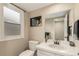 Bright bathroom featuring a modern vanity, and a stylish mirror at 7778 S Cherry Ct, Centennial, CO 80122