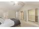 Spacious bedroom featuring vaulted ceiling and closet with open doors showcasing ample storage at 7778 S Cherry Ct, Centennial, CO 80122