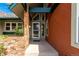 A covered front porch with brick accents that provide curb appeal at 7778 S Cherry Ct, Centennial, CO 80122
