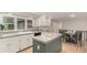 Charming kitchen featuring granite countertops, white cabinetry, and stainless steel appliances at 7778 S Cherry Ct, Centennial, CO 80122