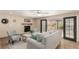 Living room featuring a fireplace and access to the backyard at 7778 S Cherry Ct, Centennial, CO 80122