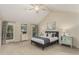 Spacious main bedroom featuring vaulted ceilings, dual windows, and stylish furnishings at 7778 S Cherry Ct, Centennial, CO 80122