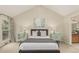Comfortable main bedroom featuring vaulted ceilings, dual windows, and stylish furnishings at 7778 S Cherry Ct, Centennial, CO 80122