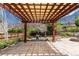 The backyard boasts a stylish pergola with a stone patio, complete with water feature and fire pit at 7778 S Cherry Ct, Centennial, CO 80122