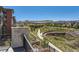 Balcony view overlooking a green space and neighborhood showcasing the tranquil surroundings and community aesthetics at 10119 Bellwether Ln, Lone Tree, CO 80124